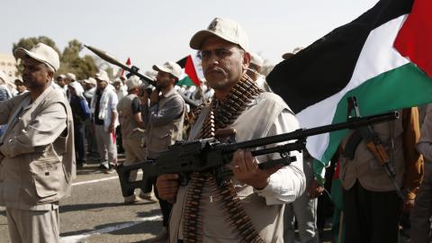 Houthi militants carry weapons at a rally against the US-led aerial attacks on Yemen on March 9, 2024, in Sana'a, Yemen. (Mohammed Hamoud via Getty Images)