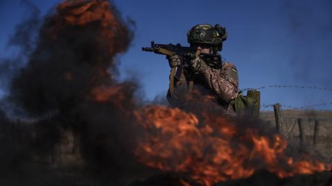 A member of a Ukrainian artillery brigade during a training session near Chasiv Yar, Ukraine, on February 27, 2024. (Photo by Cristopher Rogel Blanquet/Getty Images)