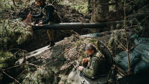 Soldiers from the Ukrainian 63rd Brigade hide an artillery unit in Donetsk Oblast, Ukraine, on April 13, 2024. (Wojciech Grzedzinski via Getty Images)