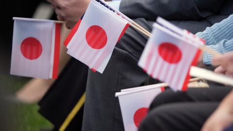 Guests hold Japanese and American flags as they wait for the arrival ceremony for Prime Minister Fumio Kishida and Mrs. Yuko Kishida of Japan at White House on April 10, 2024 in Washington, DC.  ( Andrew Harnik via Getty Images)