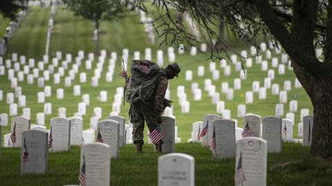 U.S. Army soldiers from the Third U.S. Infantry Regiment (The Old Guard) place flags at gravesites in Arlington National Cemetery in Arlington, Va., during the Flags In ceremony, May 23, 2024.(Elizabeth Fraser/Arlington National Cemetery/U.S. Army)