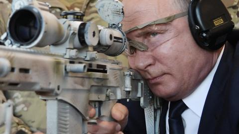 Russian President Vladimir Putin looks through the scope as he shoots a Chukavin sniper rifle during a visit to the military Patriot Park in Kubinka, outside Moscow, on September 19, 2018. (Photo by ALEXEY NIKOLSKY/SPUTNIK/AFP via Getty Images)