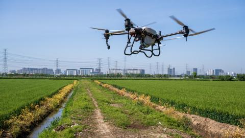 A drone sprays pesticides at Baiyutan Modern Agriculture Demonstration Park in Kunshan, China, on April 18, 2024. (Photo by Costfoto/NurPhoto via Getty Images)