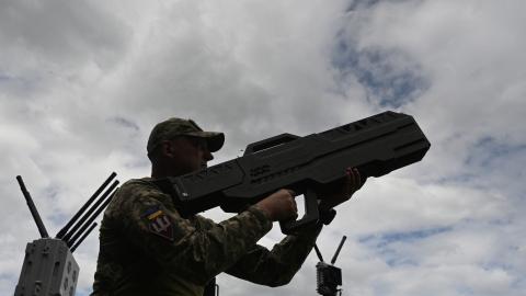 A Ukrainian serviceman tests an anti-drone gun during a presentation of radio-electronic warfare (WB) and radio-electronic intelligence (PER) systems of the Ukrainian company Kvertus in Lviv region on May 28, 2024, amid the Russian invasion of Ukraine. The event was organized by the charity foundation 'Zavzhdy UA' (Forever Ukraine) with the Ukrainian company Kvertus. (Photo by YURIY DYACHYSHYN / AFP) (Photo by YURIY DYACHYSHYN/AFP via Getty Images)