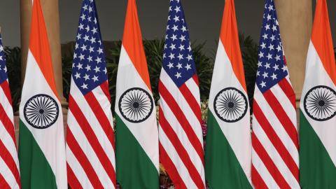 Use this for the caption: Flags on display at an India–United States summit meeting on February 25, 2020, in New Delhi. (Pallava Bagla via Getty Images)