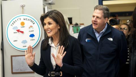 With New Hampshire Governor Chris Sununu by her side, Republican presidential candidate Nikki Haley visits a first grade class in Manchester, New Hampshire, on Friday January 19, 2024. (Melina Mara/The Washington Post via Getty Images)