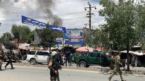Afghan security forces inspect the scene of an attack on a clinic in Kabul, Afghanistan, on May 12, 2020. (Haroon Sabawoon via Getty Images)