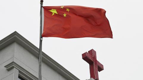 This photo taken on January 15, 2024, shows a Chinese flag fluttering on a Christian church in Pingtan, China. (Greg Baker/AFP via Getty Images)