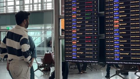 A passenger is looking at the flight board at Kempegowda International Airport in Bengaluru (Bangalore), Karnataka, India, on April 17, 2024. Kempegowda Airport is the third-busiest airport by passenger traffic in the country, behind the airports in Delhi and Mumbai, and is the 34th busiest airport in Asia. (Photo by Creative Touch Imaging Ltd./NurPhoto via Getty Images)