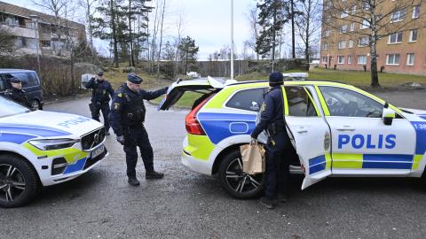 Policemen stand next to their cars in front of an apartment building in Södertälje, south of Stockholm, Sweden, on January 30, 2025, following the shooting of Koran burner Salwan Momika. Momika, who repeatedly burnt the Koran in 2023 in Sweden, sparking outrage in Muslim countries, has been shot dead, media reported on January 30, 2025, with police confirming a man died in a shooting the day before. A Stockholm court was due to rule on January 30, 2025 whether Salwan Momika, a Christian Iraqi who burned Kor