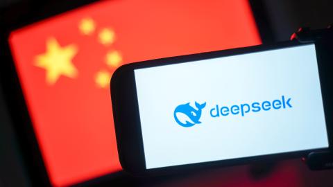 The DeepSeek logo is seen on a phone in front of a flag of China on January 28, 2025, in Hong Kong, China. (Anthony Kwan via Getty Images)