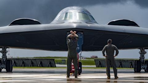 A pilot marshals a B-2 Spirit bomber at Andersen Air Force Base in Guam on June 13, 2024. (US Air Force photo)