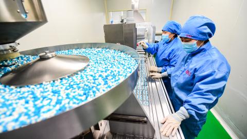 Employees work on the production line of medicine, at a factory, on January 12, 2023, in Shenyang, Liaoning Province of China. (VCG/VCG via Getty Images)
