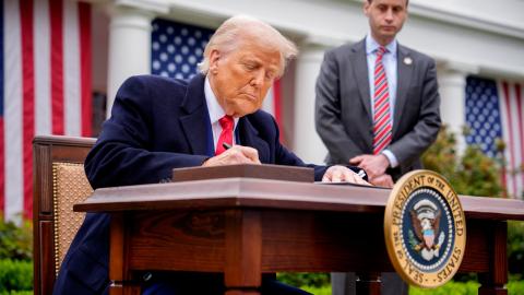 President Donald Trump signs executive orders imposing tariffs on imported goods during a trade announcement event at the White House on April 2, 2025, in Washington, DC. (Andrew Harnik via Getty Images)