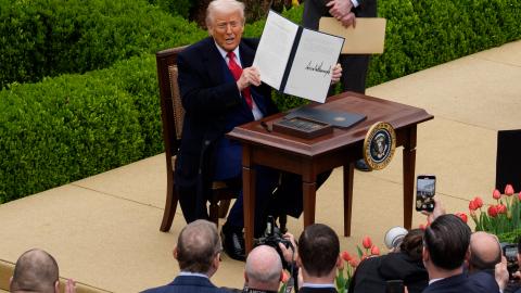 President Donald Trump signs an executive order imposing tariffs on imported goods during a "Make America Wealthy Again" trade announcement event in the Rose Garden, at the White House, on April 2, 2025, in Washington, DC. (Andrew Harnik via Getty Images)