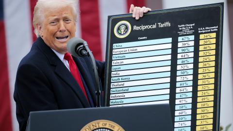 U.S. President Donald Trump holds up a chart while speaking during a “Make America Wealthy Again” trade announcement event in the Rose Garden at the White House on April 2, 2025 in Washington, DC. Touting the event as “Liberation Day”, Trump is expected to announce additional tariffs targeting goods imported to the U.S. (Photo by Chip Somodevilla/Getty Images)