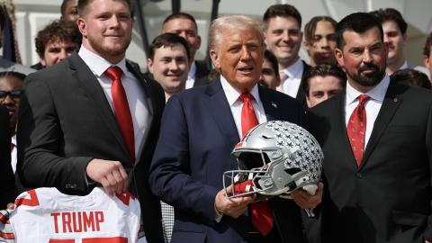 President Donald Trump stands with Ohio State Head Coach Ryan Day as he welcomes the 2025 College Football National Champions from Ohio State University to the White House during a ceremony on the south lawn on April 14, 2025. (Getty Images)