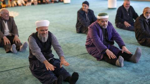 Worshippers take part in a fitness session after prayer in a mosque of the Bagcilar district in Istanbul on February 8, 2024. (Yasin Akgul via Getty Images)