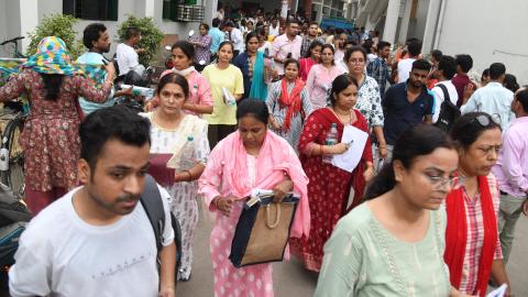 Aspirants come out from an examination center after the University Grants Commission National Eligibility Test (UGC-NET) exams at A.N. College on June 18, 2024, in Patna, India. (Santosh Kumar via Getty Images)