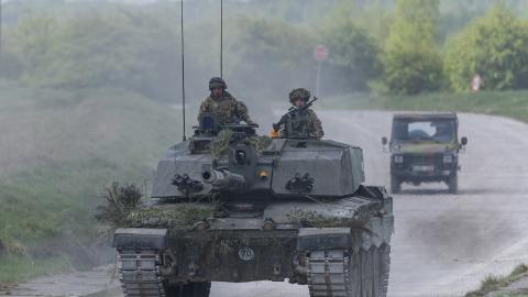 Soldiers drive a British Challenger battle tank as they take part in an urban combat exercise during a United Kingdom–French joint military maneuver near Reims, France, on April 22, 2025. (Getty Images)