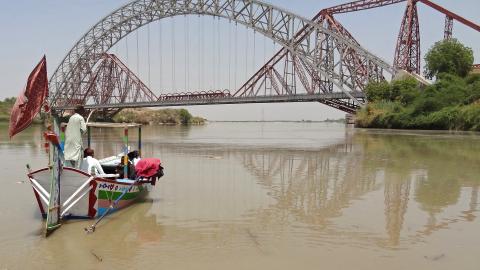 People take a boat ride in the waters of Indus River near the Lansdowne Bridge in Sukkur, Pakistan, on April 28, 2025. (Shahid Ali via Getty Images)