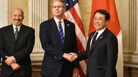 Japan's Economic Revitalisation Minister Ryosei Akazawa poses with US Treasury Secretary Scott Bessent and Commerce Secretary Howard Lutnick in Washington, DC on May 1, 2025. (STR/JIJI Press/AFP via Getty Images)