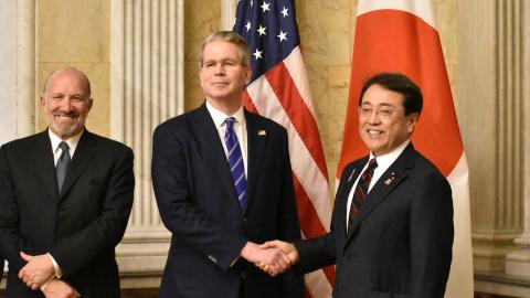 Japan's Economic Revitalisation Minister Ryosei Akazawa poses with US Treasury Secretary Scott Bessent and Commerce Secretary Howard Lutnick in Washington, DC on May 1, 2025. (STR/JIJI Press/AFP via Getty Images)