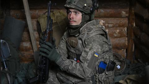 A recruit of the 28th Separate Mechanized Brigade takes a break in a dugout during field tactical training at an undisclosed location in the Donetsk Region, Ukraine, on May 1, 2025 (Genya Savilov via Getty Images)