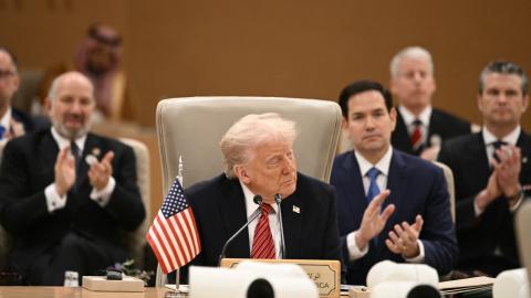 Members of the US delegation applaud as US President Donald Trump addresses leaders in Riyadh on May 14, 2025. (Brendan Smialowski via Getty Images)