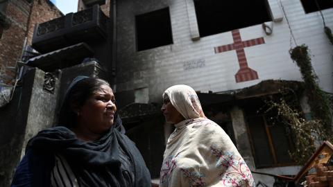 Pakistani Christian Perveen Bibi weeps outside the torched Saint John Church in Jaranwala on the outskirts of Faisalabad on August 17, 2023. (Aamir Qureshi via Getty Images)