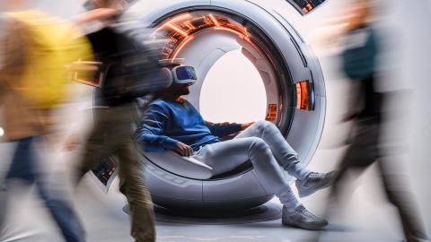 People walk past a banner displaying digital knowledge and artificial intelligence at the Frankfurt Book Fair on October 16, 2024. (Kirill Kudryavtsev via Getty Images)