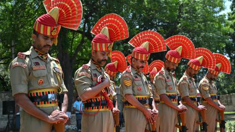 Border Security Force soldiers pay respect during a wreath-laying ceremony for Constable Deepak Chingakham of the Border Security Force, who was killed during a cross-border firing between India and Pakistan in Jammu on May 12, 2025. (Money Sharma via Getty Images)