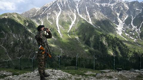 An Indian soldier stands guard near the Line of Control in Kashmir on May 19, 2025. (Tauseef Mustafa via Getty Images)