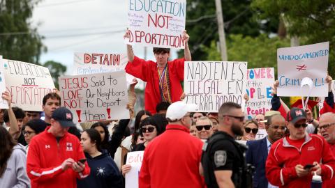 Milford High School graduates protest outside of Milford Town Hall a day after 18-year-old Marcelo Gomes Da Silva was detained by ICE on his way to volleyball practice. (Jessica Rinaldi via Getty Images)