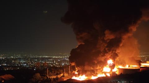 Fire and smoke rise into the sky after an Israeli attack on the Shahran oil depot on June 15, 2025, in Tehran, Iran. (Stringer via Getty Images)