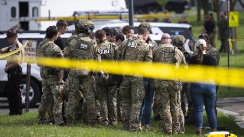 FBI agents stage in a neighborhood on June 15, 2025, in Green Isle, Minnesota as law enforcement agencies search for Vance Boelter. (Christopher Mark Juhn via Getty Images)