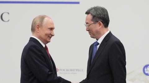Russia's President Vladimir Putin shakes hands Chinese Vice Premier Ding Xuexiang during the Saint Petersburg International Economic Forum in Saint Petersburg on June 20, 2025. (Dmitry Lovetsky via Getty Images)