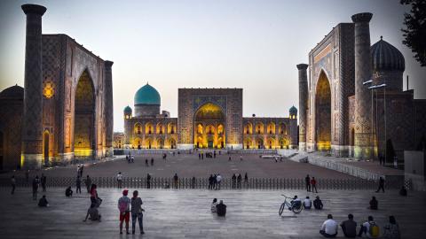 People walk in Registan Square in downtown Samarkand on September 13, 2022. A regional summit this week where Russian President Vladimir Putin will meet China's Xi Jinping and other Asian leaders will showcase an "alternative" to the Western world, the Kremlin said. Putin and Xi will be joined by the leaders of India, Pakistan, Turkey, Iran and several other countries for the summit of the Shanghai Cooperation Organisation (SCO) in the Uzbek city of Samarkand on 15-16 September 2022. (Photo by Alexander NEM