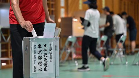 Voters take part in upper house elections at a polling station in Tokyo on July 20, 2025. Japanese Prime Minister Shigeru Ishiba faces a reckoning from voters with upper house elections on July 20 that could end his premiership and see a right-wing populist party make inroads. (Photo by Richard A. Brooks / AFP) (Photo by RICHARD A. BROOKS/AFP via Getty Images)