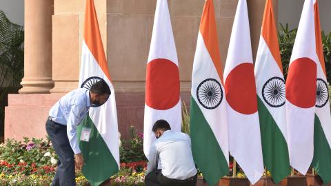 Workers arrange national flags of Japan and India ahead of a meeting between Indian Prime Minister Narendra Modi and Japanese Prime Minister Fumio Kishida at Hyderabad House on March 19, 2022, in New Delhi, India. (Sonu Mehta via Getty Images)