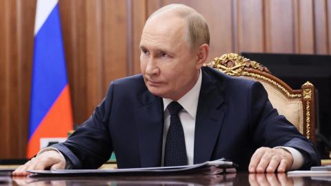 In this pool photograph distributed by the Russian state agency Sputnik, President Vladimir Putin meets with Moscow-installed head of the Donetsk region in Russian-controlled Ukraine, Denis Pushilin (not pictured), at the Kremlin in Moscow on August 4, 2025. (Mikhail Metzel via Getty Images)