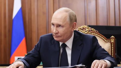 In this pool photograph distributed by the Russian state agency Sputnik, President Vladimir Putin meets with Moscow-installed head of the Donetsk region in Russian-controlled Ukraine, Denis Pushilin (not pictured), at the Kremlin in Moscow on August 4, 2025. (Mikhail Metzel via Getty Images)