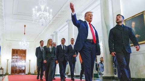 President Donald Trump leads President Volodymyr Zelenskyy and other European leaders in the Cross Hall of the White House on August 18, 2025. (Aaron Schwartz via Getty Images)