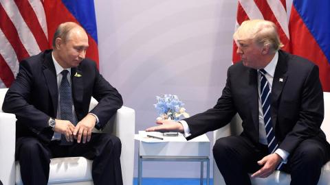 US President Donald Trump and Russia's President Vladimir Putin shake hands during a meeting on the sidelines of the G20 Summit in Hamburg, Germany, on July 7, 2017. (Photo by SAUL LOEB / AFP) (Photo by SAUL LOEB/AFP via Getty Images)