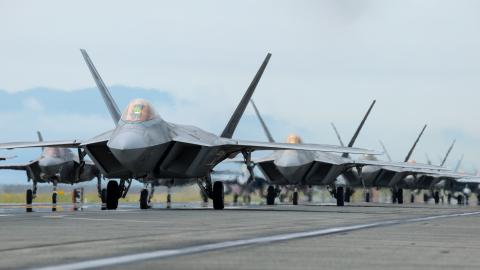 The U.S. Air Force 354th Air Expeditionary Wing and Marine Aircraft Group 12 performed a capabilities demonstration during a pre-planned readiness exercise at Marine Corps Air Station Iwakuni, Japan, July 7, 2022. The demonstration included U.S. Marine Corps F/A-18 Hornets, F-35B Lighting IIs, KC-130J Super Hercules aircraft, and U.S. Air Force F-22 Raptors and F-35A Lighting II aircraft, showcasing a high level of readiness and joint service capability in support of a free and open Indo-Pacific. (U.S. Mari