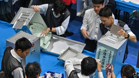 Election administration officials open ballot boxes in Tokyo on October 27, 2024. (Getty Images)