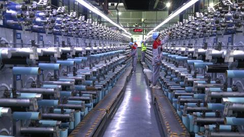 OCTOBER 14: Workers check the operation of carbon fiber production line at Zhongfu Shenying Carbon Fiber Co., Ltd. on October 14, 2025 in Xining, Qinghai Province of China. (Photo by Zhang Zhongping/VCG via Getty Images)