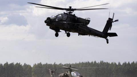 AH-64 Apache helicopters depart a forward arming and refueling point to conduct aerial gunnery tables at Pabradė Training Area in Lithuania on September 9, 2025. (US Army)