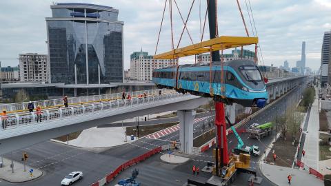 A light rail train is lifted onto the track in Astana, Kazakhstan, on October 19, 2025. (Getty Images)
