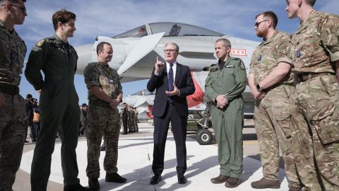 Britain’s Prime Minister Keir Starmer speaks with British armed forces personnel in front of a UK Typhoon fighter jet in Ankara, Turkey, on October 27, 2025. (Getty Images)